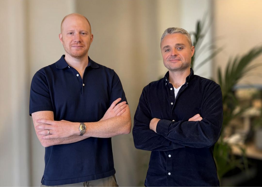 Two members of the Optimal and Source.ag teams standing side by side